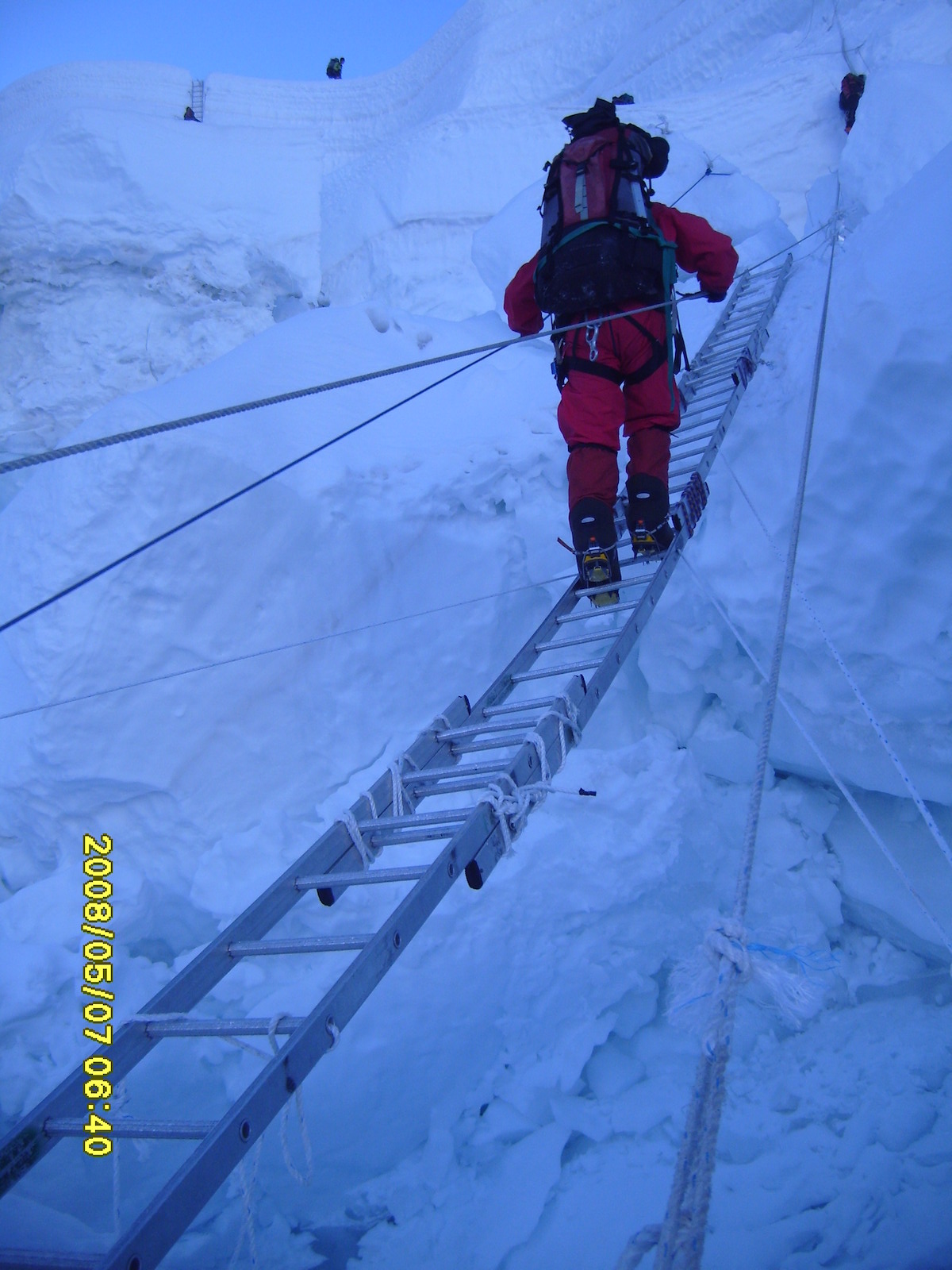 Crossing ladder on Khumbu Ice Fall on Mt Everest 
